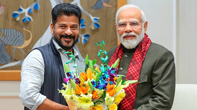 PTI : Telangana CM Revanth Reddy with PM Narendra Modi
