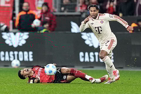 Bundesliga 2024-25: Leverkusen's Exequiel Palacios reacts as Bayern's Serge Gnabry in action