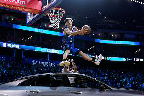 Slam Dunk Contest: Osceola Magic guard Mac McClung dunks over a car