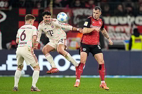 Bundesliga 2024-25: Bayern's Aleksandar Pavlovic in action against Leverkusen's Granit Xhaka
