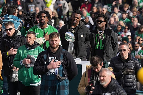 Super Bowl Eagles Parade: Eagles players stand by the Lombardi trophy