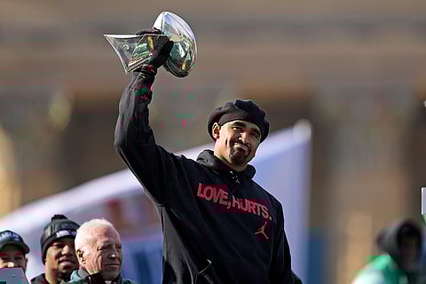 Super Bowl Eagles Parade: Eagles quarterback Jalen Hurts holds up the Lombardi trophy