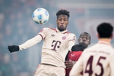 Bundesliga 2024-25: Bayern's Kingsley Coman challenges for the ball with Leverkusen's Nordi Mukiele