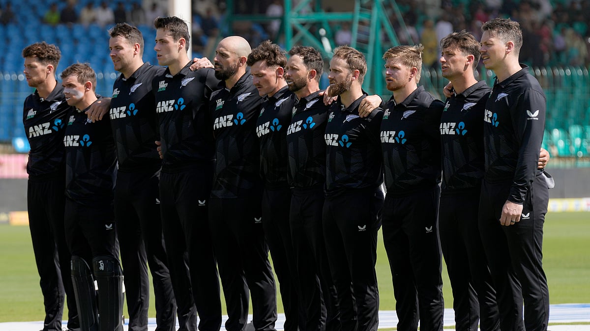 (AP Photo/Fareed Khan) : Players of New Zealand stand silent for their national anthem before start of the tri-series ODI cricket final match between Pakistan and New Zealand, in Karachi, Pakistan, Friday, Feb. 14, 2025. 