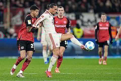 Bundesliga 2024-25: Leverkusen's Exequiel Palacios challenges for the ball with Bayern's Leroy Sane