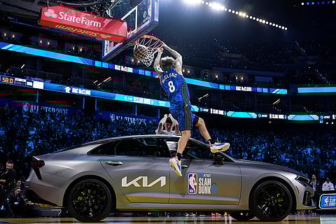 Slam Dunk Contest: Osceola Magic guard Mac McClung dunks over a car