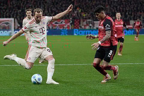 Bundesliga 2024-25: Bayern's Harry Kane kicks the ball ahead Leverkusen's Piero Hincapie