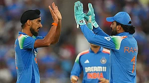 | Photo: AP/Ajit Solanki : IND vs ENG 3rd ODI: India's Arshdeep Singh celebrates the wicket of England's Phil Salt
