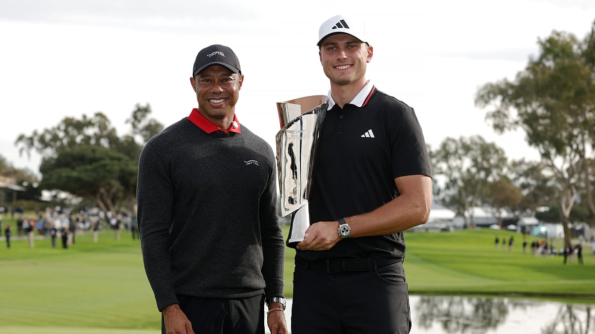 Ludvig Aberg poses with Tiger Woods after winning the Genesis Invitational