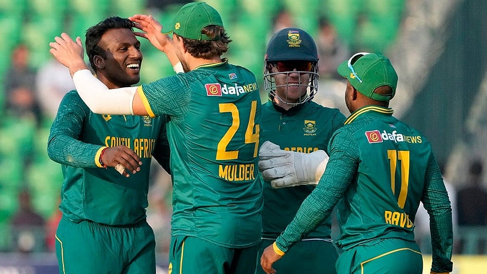 | Photo: AP/K.M. Chaudary : Pakistan Tri-Series Cricket Match 2, NZ Vs SA: South Africa's Senuran Muthusamy celebrates after taking the wicket of New Zealand's Daryl Mitchell 