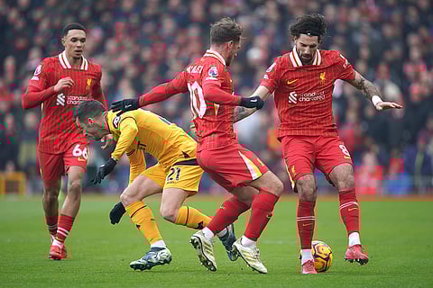 EPL 2024-25: Wolves' Pablo Sarabia, second left, challenges for the ball with Liverpool's Alexis Mac Allister
