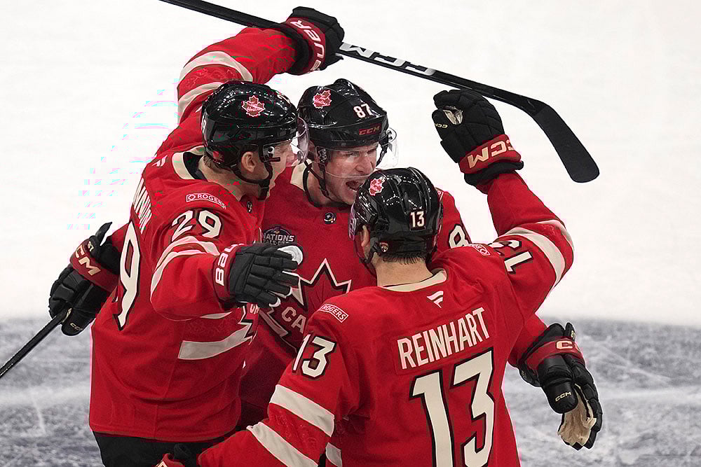| Photo: AP/Charles Krupa : 4 Nations Face-Off, Canada vs Finland: Canada's Sidney Crosby, center, celebrates after his goal 