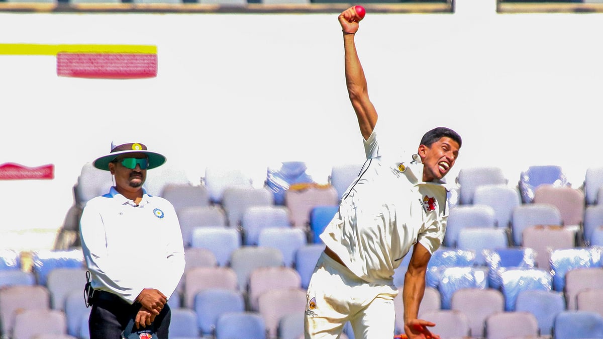 Photo: PTI : Tanush Kotian bowls on Day 1 of the Ranji Trophy semi-final between Mumbai and Vidarbha in Nagpur.