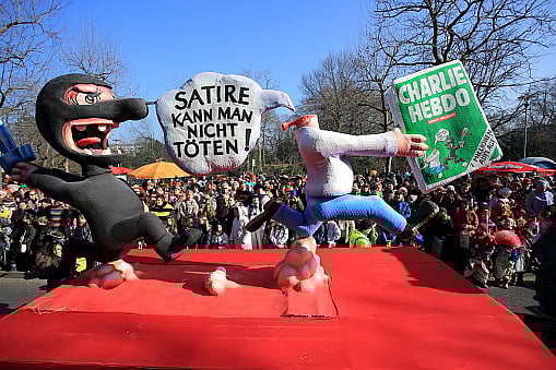 stock photo : In Germany, a Charlie Hebdo themed float with the inscription 'Satire cannot get killed' 