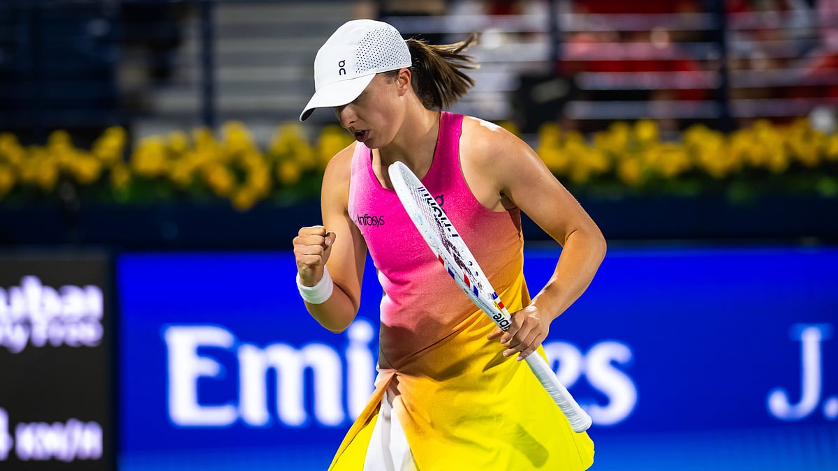 Iga Swiatek celebrates her win over Victoria Azarenka at the Dubai Tennis Championships