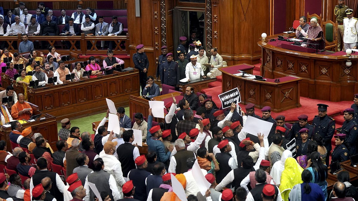 PTI : Samajwadi Party leaders protest during the joint sitting of both Houses addressed by Uttar Pradesh Governor Anandiben Patel, marking the beginning of the state Assembly budget session, in Lucknow, Tuesday, Feb. 18, 2025. 