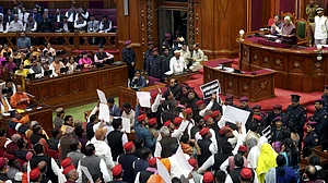PTI : Samajwadi Party leaders protest during the joint sitting of both Houses addressed by Uttar Pradesh Governor Anandiben Patel, marking the beginning of the state Assembly budget session, in Lucknow, Tuesday, Feb. 18, 2025.