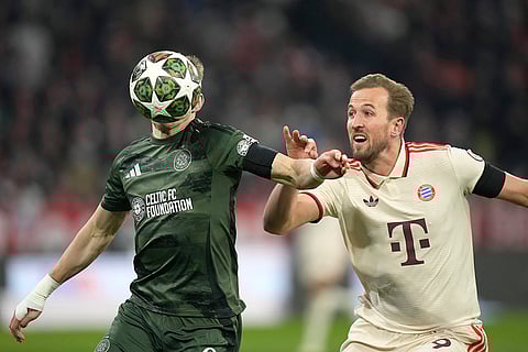 Champions League Soccer playoff second leg: Bayern's Harry Kane challenges for the ball with Celtic's Alistair Johnston