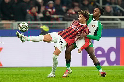 Champions League Soccer playoff second leg: AC Milan's Joao Felix challenges for the ball with Feyenoord's Antoni Milambo