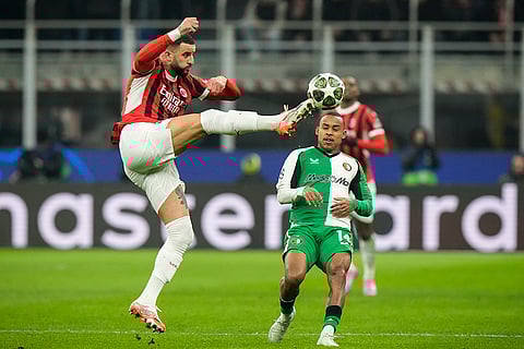Champions League Soccer playoff second leg: AC Milan's Kyle Walker challenges for the ball with Feyenoord's Igor Paixao