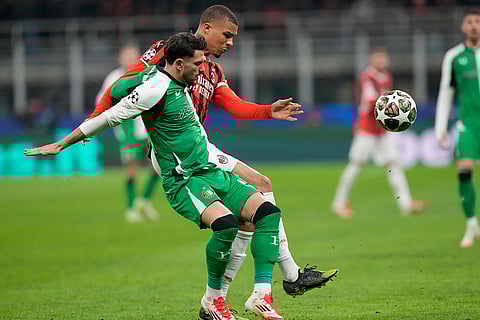 Champions League Soccer playoff second leg: Feyenoord's Julian Carranza challenges with AC Milan's Malick Thiaw