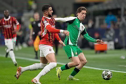 Champions League Soccer playoff second leg: AC Milan's Kyle Walker challenges for the ball with Feyenoord's Gijs Smal
