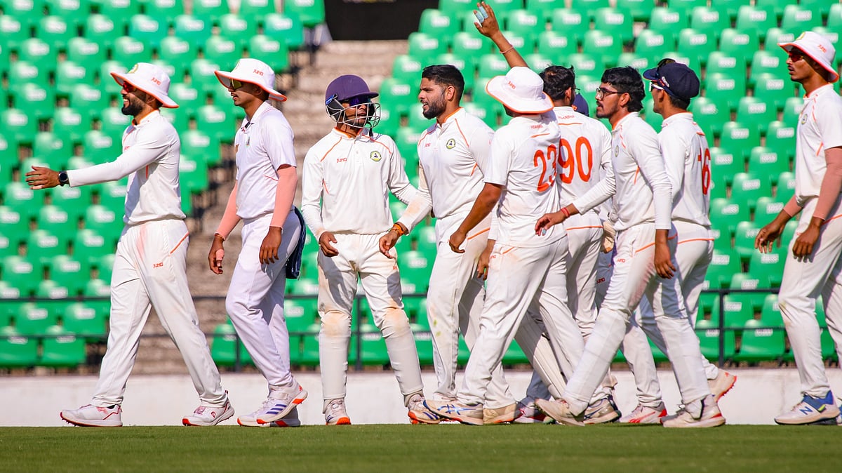 PTI : Vidarbha's Parth Rekhade celebrates with teammates after taking the wicket of Mumbai's Suryakumar Yadav during the second day of a Ranji Trophy semi-final cricket match between Mumbai and Vidarbha.