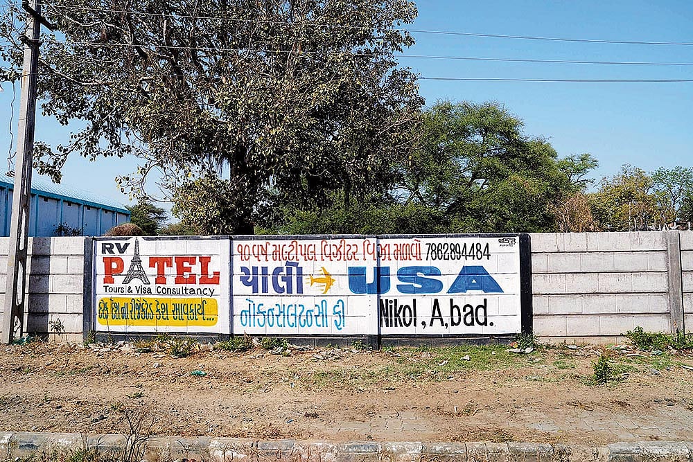 The American Dream: An ad “inviting” people to apply for US visa in a village in Kalol tehsil in Gandhinagar, Gujarat