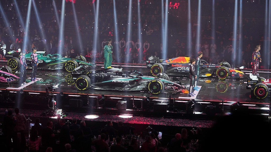 Photo: AP : Drivers stand next to their cars during the F1 75 Live launch event at the O2 arena in London.
