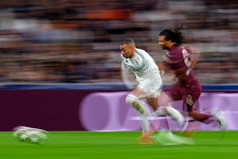 Champions League playoff second leg: Manchester City's Nathan Ake challenges Real Madrid's Kylian Mbappe