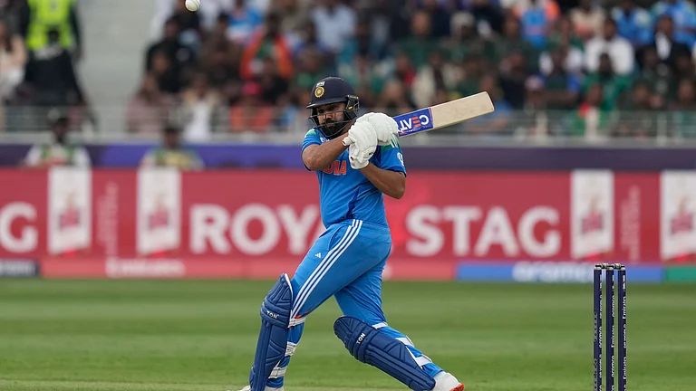 Rohit Sharma hits a shot during the ICC Champions Trophy game against Bangladesh - Altaf Qadri/AP
