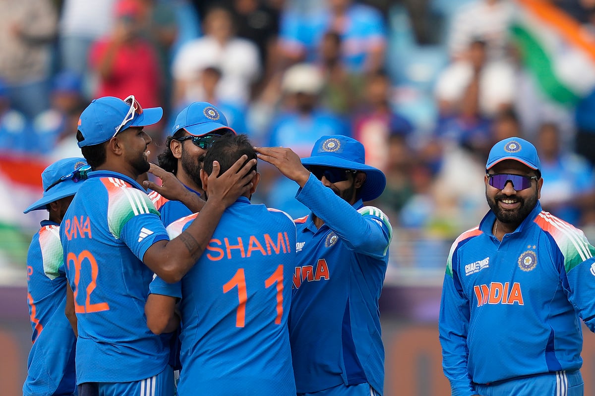(AP Photo/Altaf Qadri) : India's Mohammed Shami, center, is congratulated by his teammates after a five-wicket haul during the ICC Champions Trophy cricket match between India and Bangladesh at Dubai International Cricket Stadium in Dubai, United Arab Emirates, Thursday, Feb. 20, 2025. 