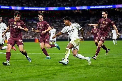 Champions League playoff second leg: Real Madrid's Rodrygo controls the ball