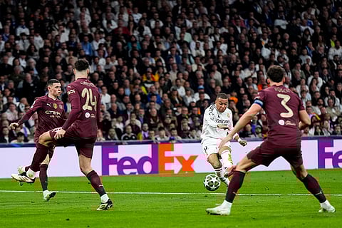 Champions League playoff second leg: Real Madrid's Kylian Mbappe shoots to score his sides third goal