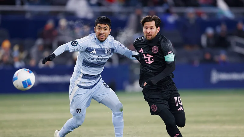 Sporting Kansas City midfielder Memo Rodríguez left, Messi right. AP