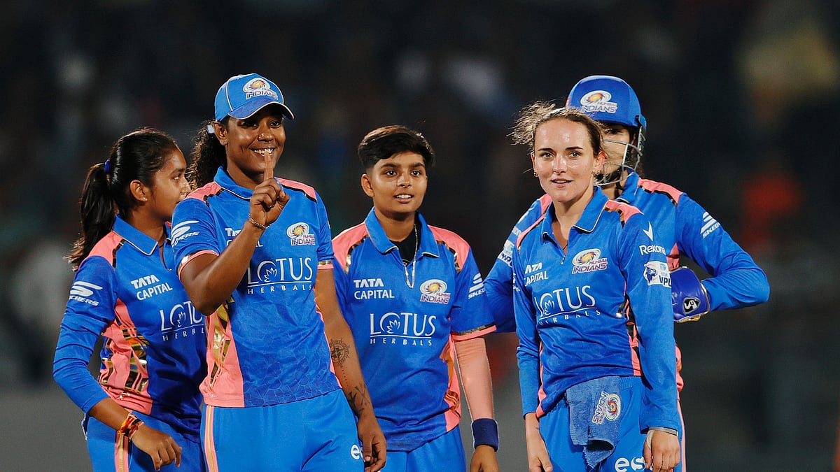 X/@wplt20 : MI players erupt in celebration after taking a wicket 