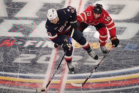 4 Nations Face-Off Final: United States' Adam Fox battles Canada's Mitch Marner for the puck