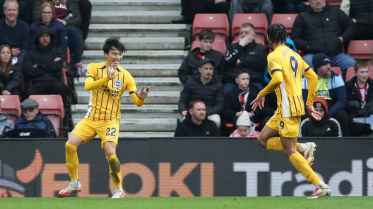 Kaoru Mitoma celebrates his goal with Joao Pedro during Brighton's 4-0 win at Southampton. - null