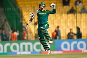 (AP Photo/Anjum Naveed) : South Africa's Ryan Rickelton celebrates after scoring century during the ICC Champions Trophy cricket match between Afghanistan and South Africa, in Karachi, Pakistan Friday, Feb. 21, 2025.