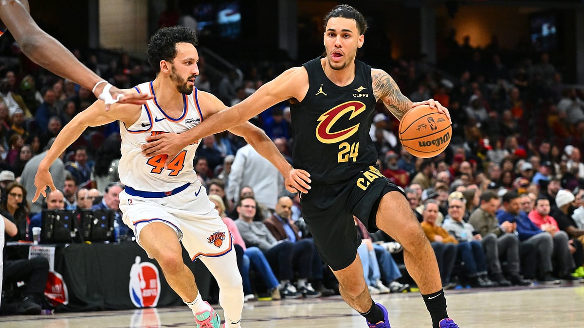 Jaylon Tyson #24 of the Cleveland Cavaliers drives to the basket around Landry Shamet #44 of the New York Knicks during the fourth quarter at Rocket Arena on February 21, 2025 in Cleveland, Ohio. The Cavaliers defeated the Knicks 142-105.