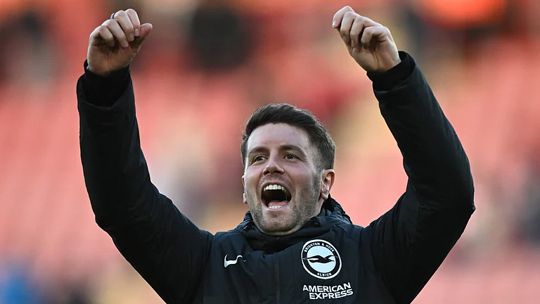 Fabian Hurzeler celebrates with the Brighton fans after their 4-0 win over Southampton. - null