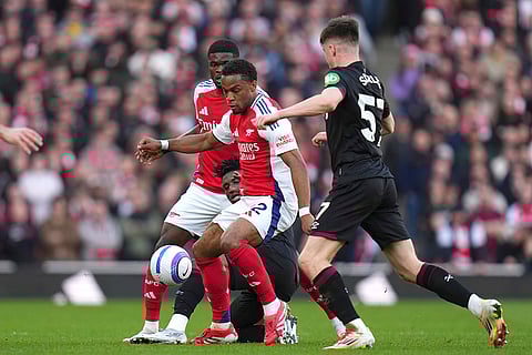 EPL Arsenal vs West Ham: Arsenal's Jurrien Timber challenges for the ball with West Ham's Oliver Scarles