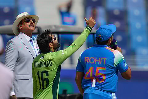 ICC Champions Trophy, IND vs PAK: Pakistan's captain Mohammad Rizwan tosses the coin, as India's captain Rohit Sharma looks