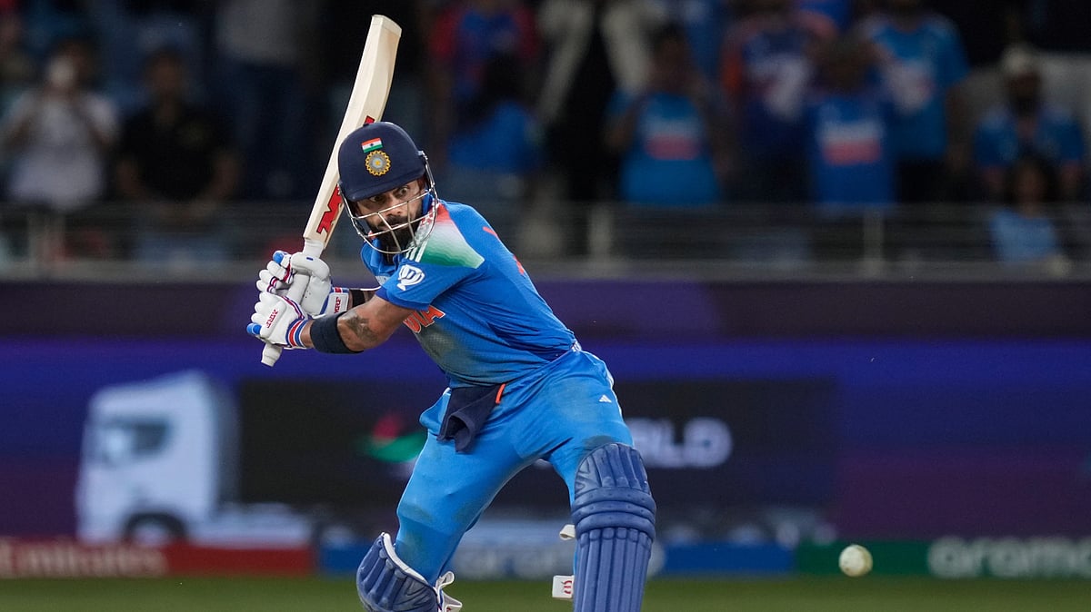 AP Photo/Altaf Qadri : India's Virat Kohli hits winning runs during the ICC Champions Trophy cricket match between India and Pakistan at Dubai International Cricket Stadium. 
