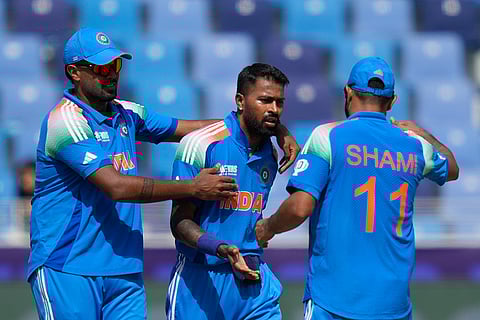 ICC Champions Trophy, IND vs PAK: India's Hardik Pandya celebrates with teammate the wicket of Pakistan's Babar Azam