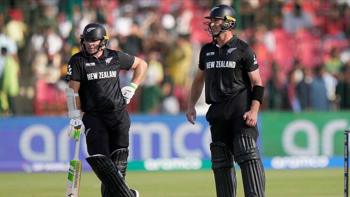 AP Photo/Anjum Naveed : New Zealand's Tom Latham, left, and Will Young wait for third umpire during the ICC Champions Trophy cricket match between Pakistan and New Zealand, in Karachi.