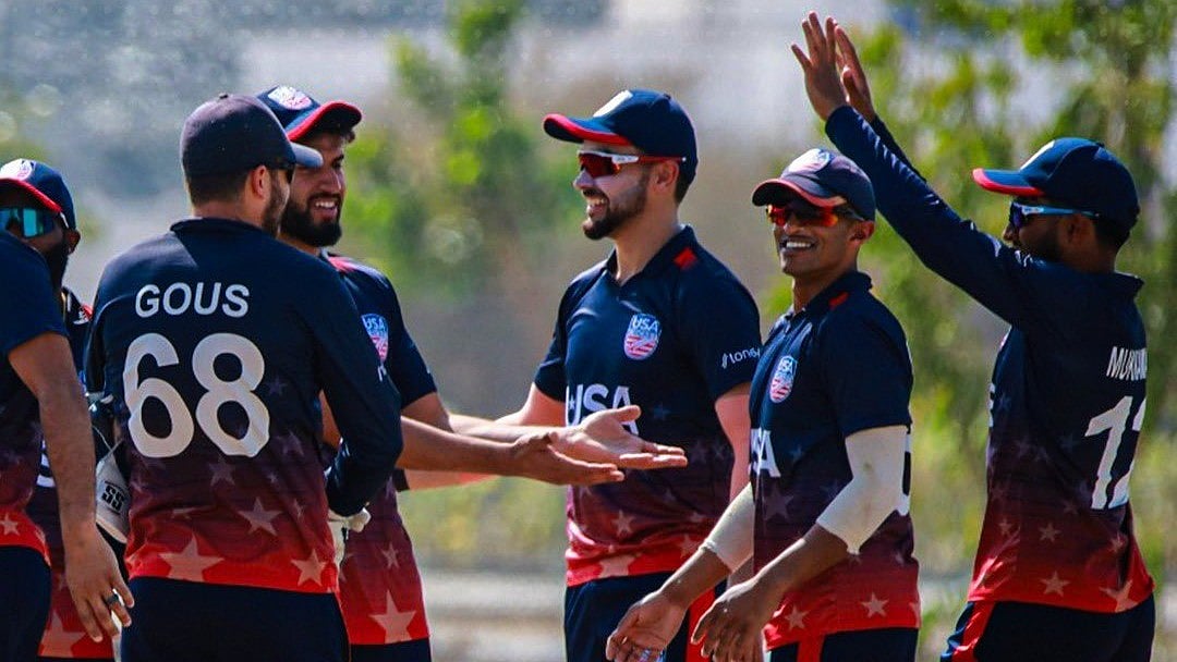 X/USA Cricket : The United States cricket team celebrate an Oman wicket during the third T20I in Al Amerat.
