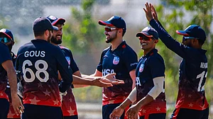 X/USA Cricket : The United States cricket team celebrate an Oman wicket during the third T20I in Al Amerat.