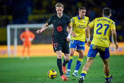 La Liga 2024-25: Barcelona's Frenkie de Jong duels for the ball with Las Palmas' Valentin Alejandro Pezzolesi