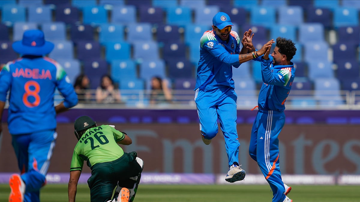 AP Photo/Altaf Qadri : India's Axar Patel, second from right, celebrates with Kuldeep Yadav after he runs out Pakistan's Imam-ul-Haq, second from left, during the ICC Champions Trophy cricket match between India and Pakistan at Dubai International Cricket Stadium.